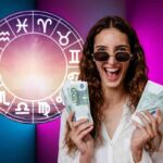 Donna con soldi e segni zodiacali